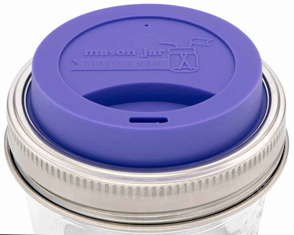 https://www.unpackedliving.com/cdn/shop/products/mason-jar-lifestyle-silicone-drinking-lid-stainless-steel-band-wide-mouth-mason-jars-ultra-violet_1024x1024.jpg?v=1628701294